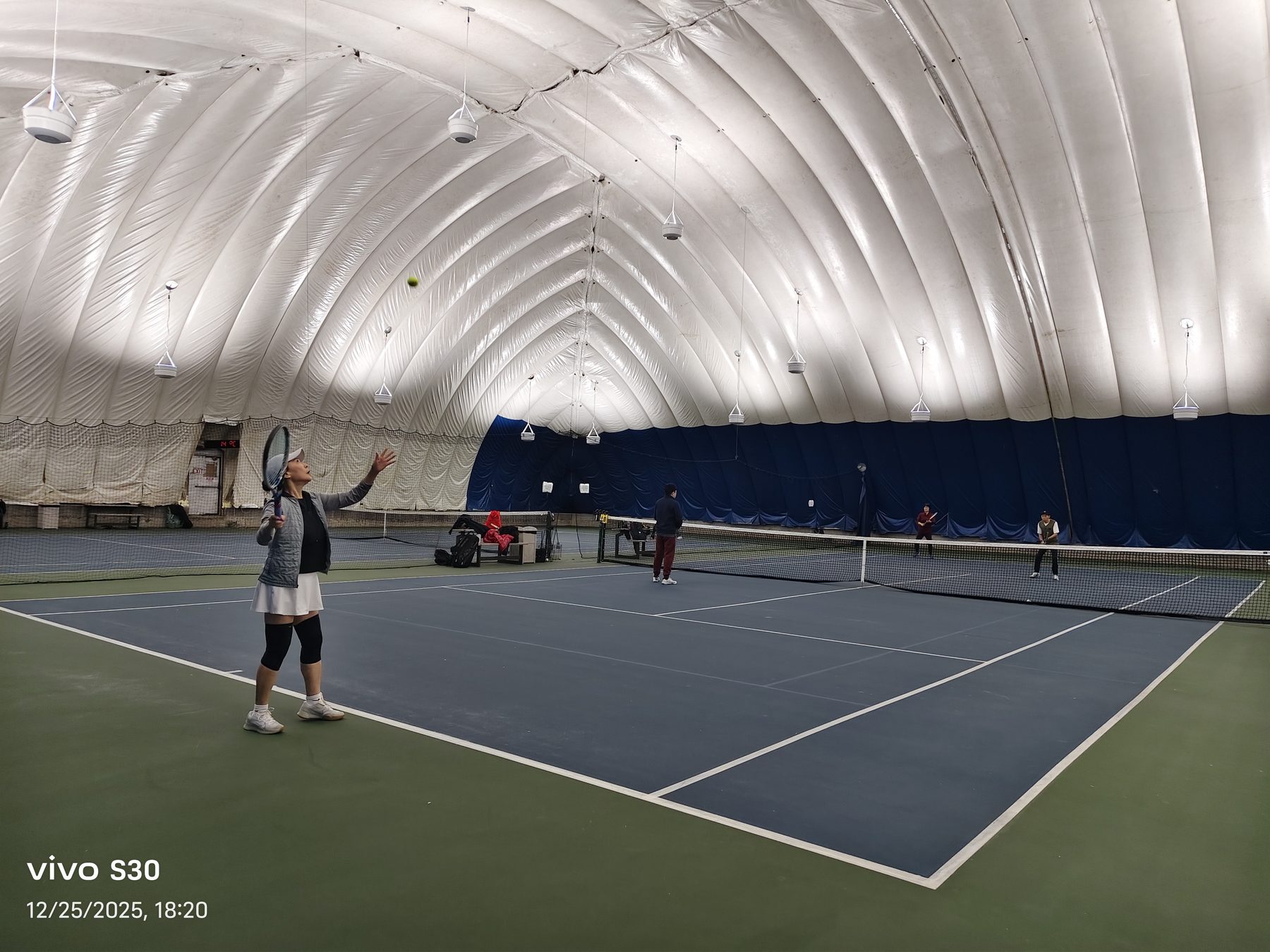 Indoor tennis serve during the Christmas event