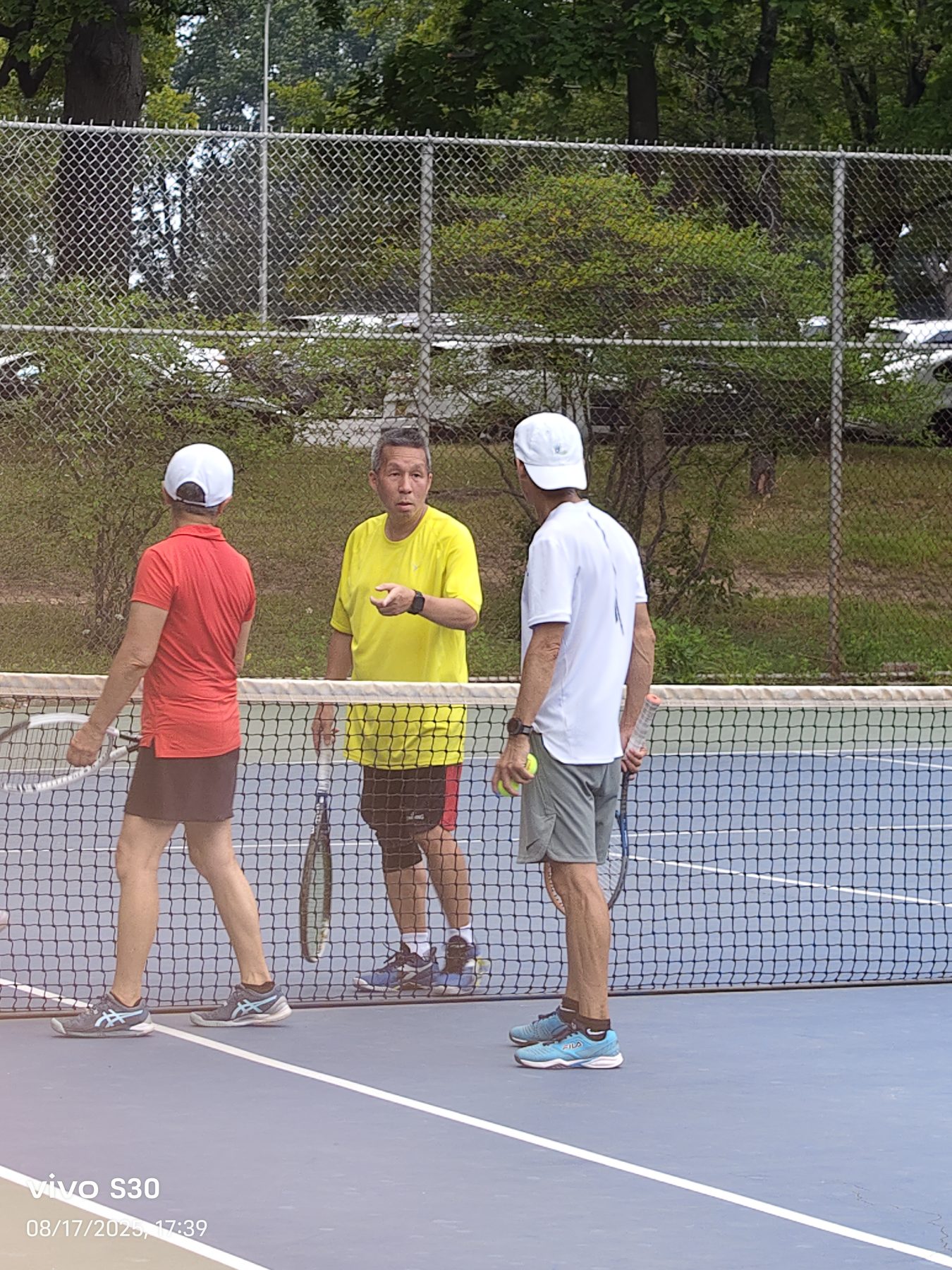 Players talking together at the net