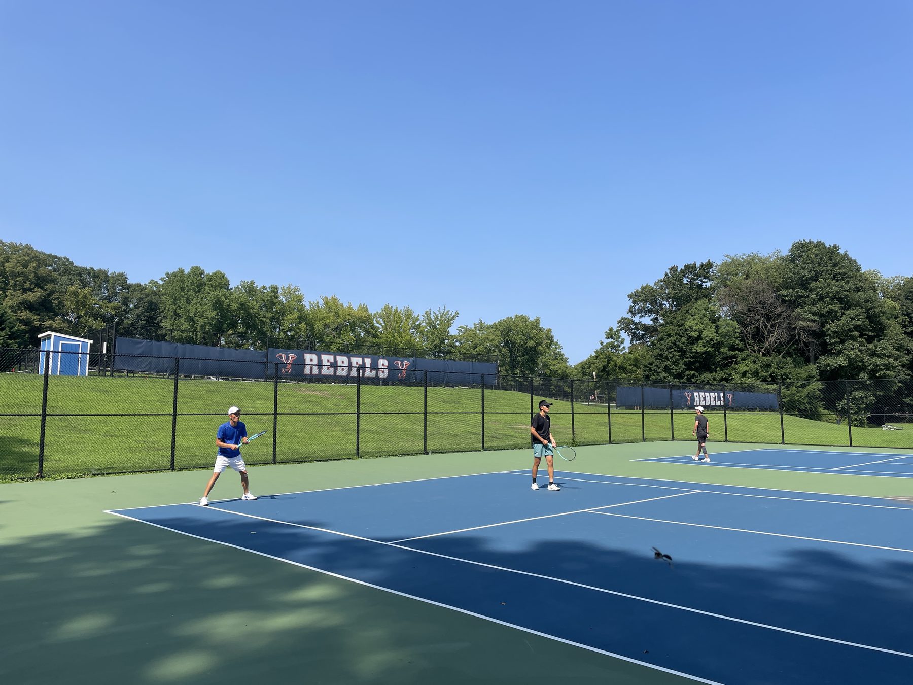 Men’s doubles players ready on court
