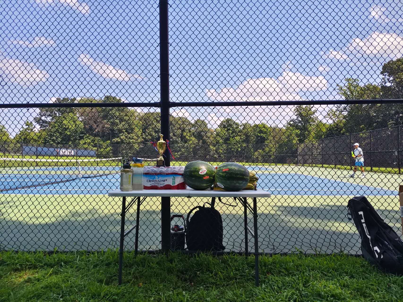 Trophy and refreshments overlooking the tennis courts
